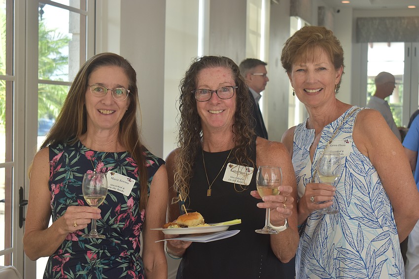Lake Club's Marie Keesee, Kathy Powell and Karen Olsen check out the Allan Scott Winery booth. The winery is family owned and operated in Marlborough, New Zealand.