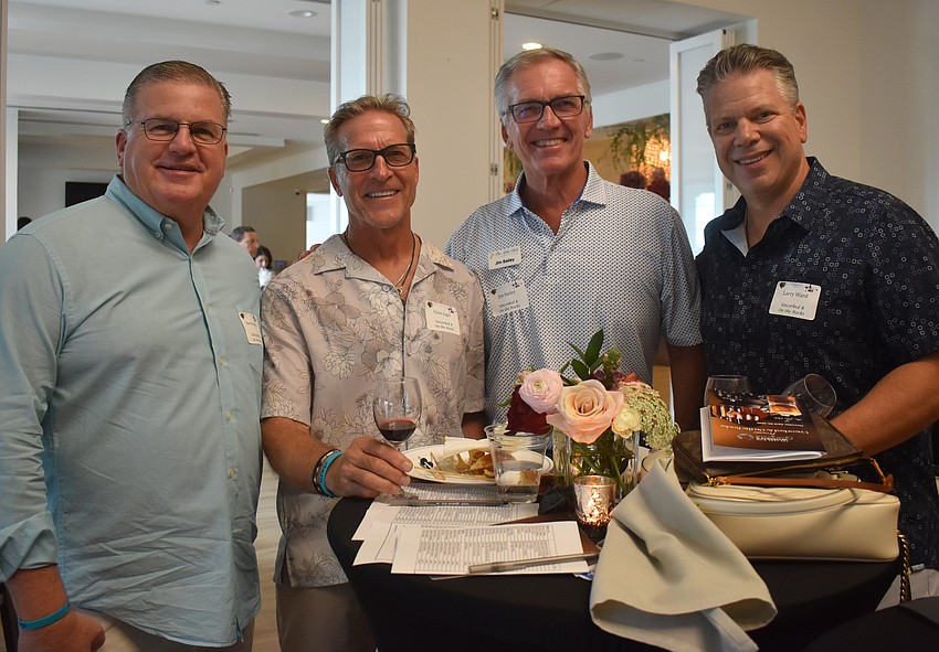 Lake Club's Kevin Lynch, Chris Jagel, Jim Bailey and Larry Ward attend the Uncorked & On the Rocks fundraiser. Bailey says while the food and wine are great, it's about connecting with people.